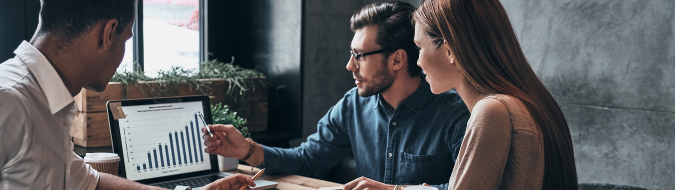 man and woman with a banker reviewing cash management on laptop